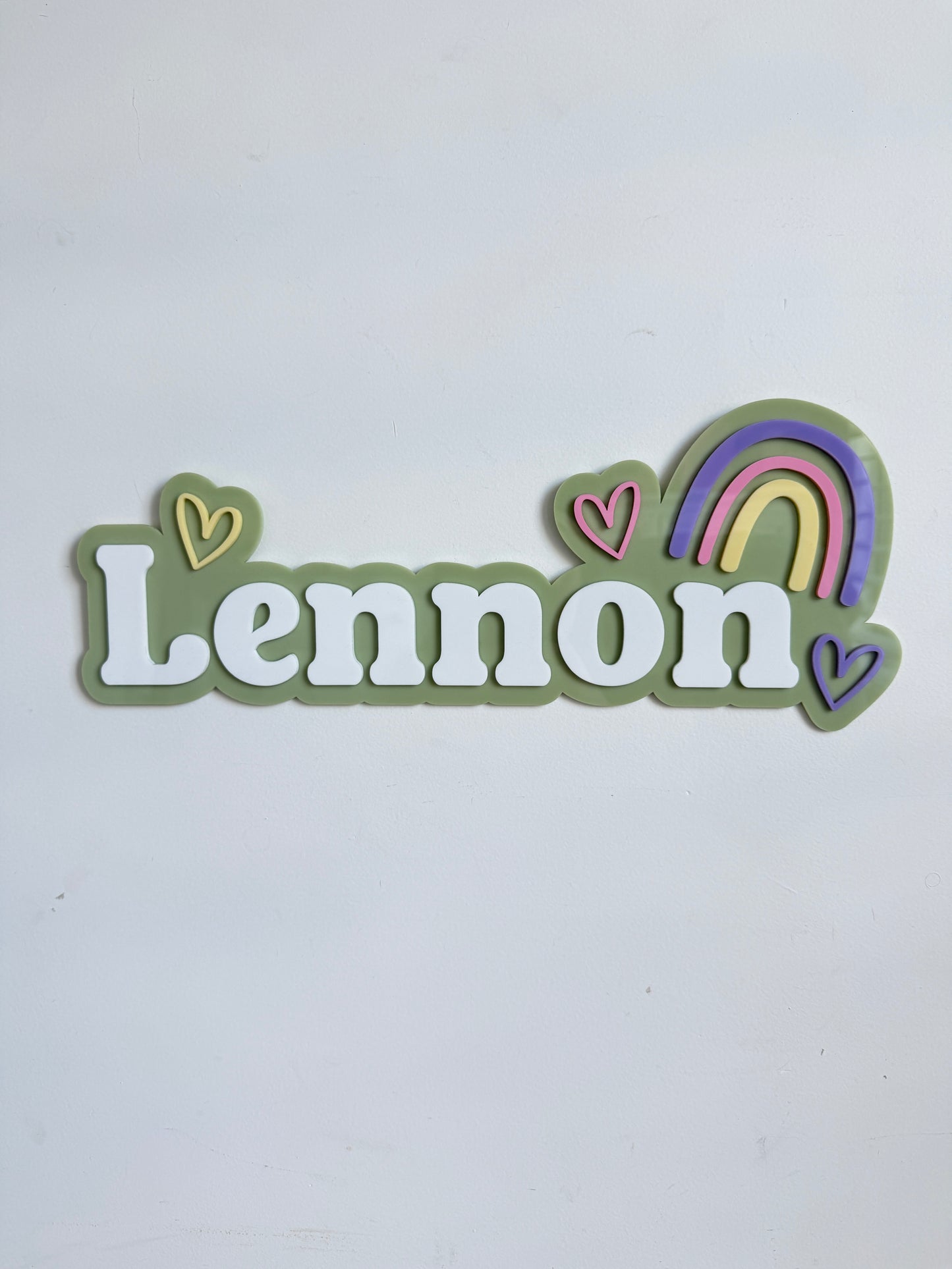 Hearts and rainbow bubble name sign